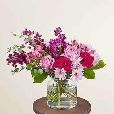 Send our Lollipop Bouquet as a sweet Mother's Day treat or to an unexpecting friend. Designed with berry hues that will brighten their day and fill their room with purple carnations, lavender roses and daisies. These happy stems are paired with beautiful eucalyptus for a stunning spring aesthetic.